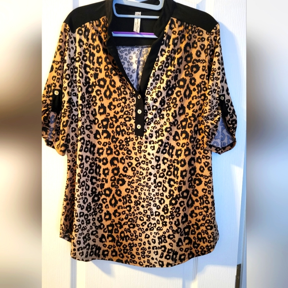 Women's v neck animal print blouse. Size L